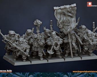 May include: A set of grey miniature figurines depicting a group of dwarven rangers standing on a rectangular base. The figures are equipped with various weapons, including axes and a staff, and one figure holds a large banner with a triangular emblem.