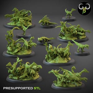 May include: A collection of lime green 3D printed dinosaur miniatures on black circular bases. The figures depict various raptor-like creatures in dynamic poses, some standing individually and others in groups on rocky terrain. Text reads PRESUPPORTED STL.