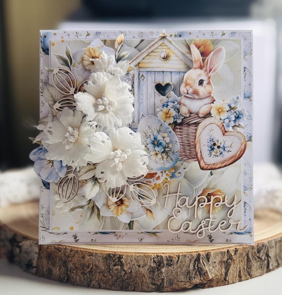 A 3D pop-up Easter card with a floral bunny scene that unfolds like a tiny diorama — way more memorable than a flat card.