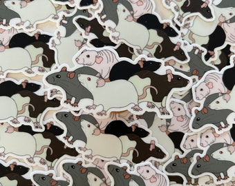 May include: A collection of stickers featuring cartoon rats in various poses. The rats are depicted in black, white, and brown colors, with some having pink accents. The stickers are arranged in a random pattern, creating a playful and whimsical design.