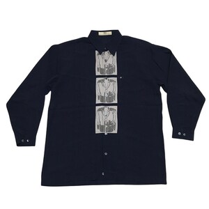 May include: A navy blue long-sleeved button-down shirt with a white panel featuring a repeated image of a button-down shirt.