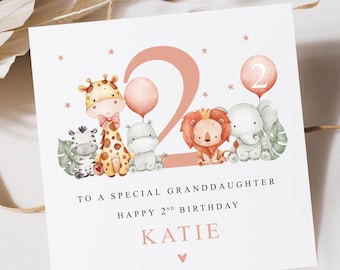 May include: A pink and white card with a pink number 2 and a group of cartoon animals. The text reads "To a special granddaughter Happy 2nd Birthday Katie".