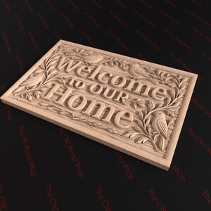 May include: A rectangular wooden sign with the words "Welcome to Our Home" carved into the surface. The sign features carved birds and foliage around the edges, creating a welcoming aesthetic.