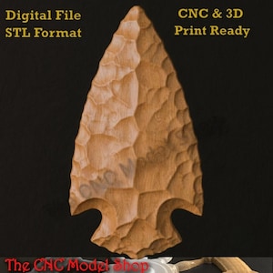 May include: A light brown, textured arrowhead model with a faceted surface. The text reads: Digital File, STL Format, CNC & 3D Print Ready, and The CNC Model Shop. The design features a pointed tip and a notched base, presented as a digital file.