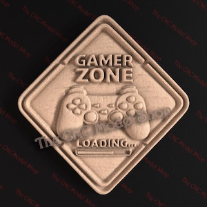 Może przedstawiać: Drewniany znak z napisem "GAMER ZONE" i wzorem kontrolera do gier. Znak zawiera również słowo "LOADING..." i pasek postępu. Znak ma kształt rombu z zaokrąglonymi rogami.