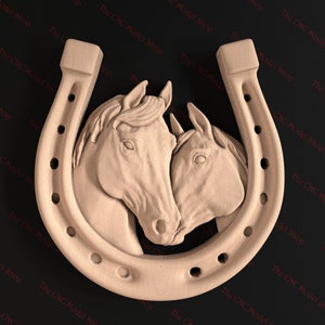 May include: A wooden carving of two horses' heads, facing each other, inside a horseshoe. The carving is a light brown colour.