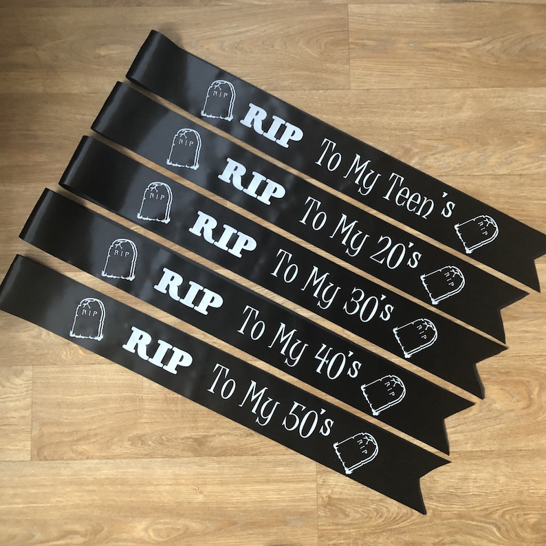 May include: Black satin sashes with white text and tombstone graphics. Each sash reads "RIP" followed by "To My Teen's", "To My 20's", "To My 30's", "To My 40's", and "To My 50's".