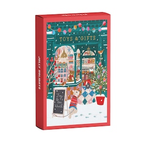 Könnte beinhalten: Eine rechteckige rote Schachtel mit einer festlichen Illustration eines Spielzeugladens mit dem Text TOYS & GIFTS und JOLLY HOLIDAYS. Die Szene zeigt einen Hund in einem roten Pullover, einen geschmückten Weihnachtsbaum und ein Schild Joy to the World.