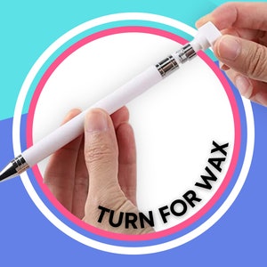 May include: A white pen with a silver twist mechanism. The pen has a white cap that can be unscrewed to reveal a wax stick. The text "TURN FOR WAX" is printed on the pen.