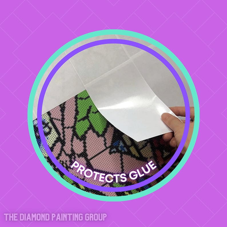 May include: A close-up of a white protective sheet being peeled back from a diamond painting canvas. The canvas has a colorful design and the text "Protects Glue" is visible.