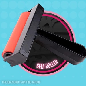 May include: A black and red gem roller tool with a pink and black circle around it that says "GEM ROLLER".