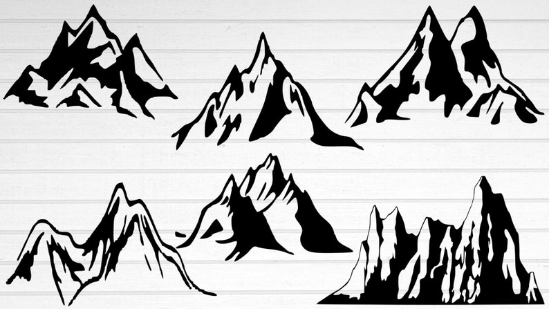 Puede incluir: Colecci&oacute;n de seis siluetas de monta&ntilde;as negras con picos y formas variadas. Los dise&ntilde;os gr&aacute;ficos son adecuados para diversos proyectos creativos. Las monta&ntilde;as est&aacute;n sobre un fondo blanco con vetas de madera.