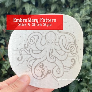 May include: White embroidery pattern with a gray octopus design on a white background. The pattern is labeled "Embroidery Pattern Stick & Stitch Style" and includes the text "@horrorpopdesigns".