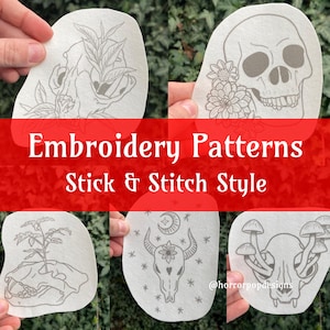 May include: Four embroidery patterns in a stick and stitch style. The patterns are on white fabric and feature a skull with flowers, a skull with a plant, a skull with mushrooms, and a skull with a crescent moon and stars.