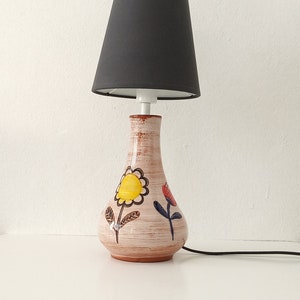 Handmade pottery flower pattern bedside table lamp.