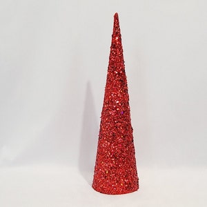 May include: A red glitter cone Christmas tree decoration.