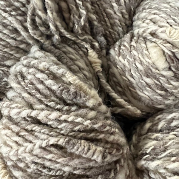 Handspun Romeldale/CVM “novelty” yarn in Natural Grey/White, from our flock, SE2SE.