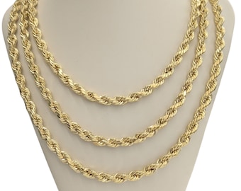 May include: Three gold rope chains of different lengths, displayed on a white mannequin bust.