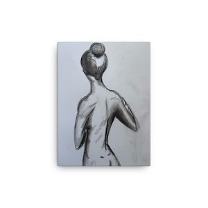 Black and white charcoal sketch of woman on canvas