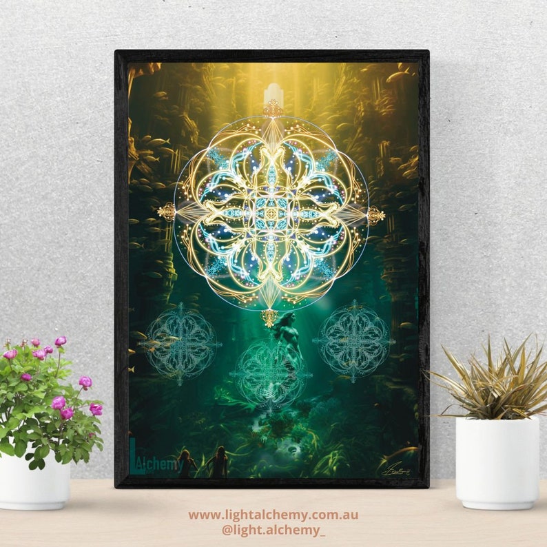May include: A digital art print featuring a geometric mandala design in shades of blue and gold. The mandala is surrounded by a green and blue background with a figure standing in the center. The print includes the text "Alchemy" and the website address "www.lightalchemy.com.au".