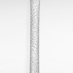 May include: White golf club grip with a gray elephant print pattern.