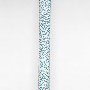 May include: A blue and white golf club grip with a unique patterned design.
