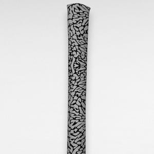 May include: A cylindrical object featuring a repeating black and grey elephant print pattern. The design consists of irregular, cracked shapes covering the entire visible surface of the vertical item, which has a smooth, uniform texture throughout.