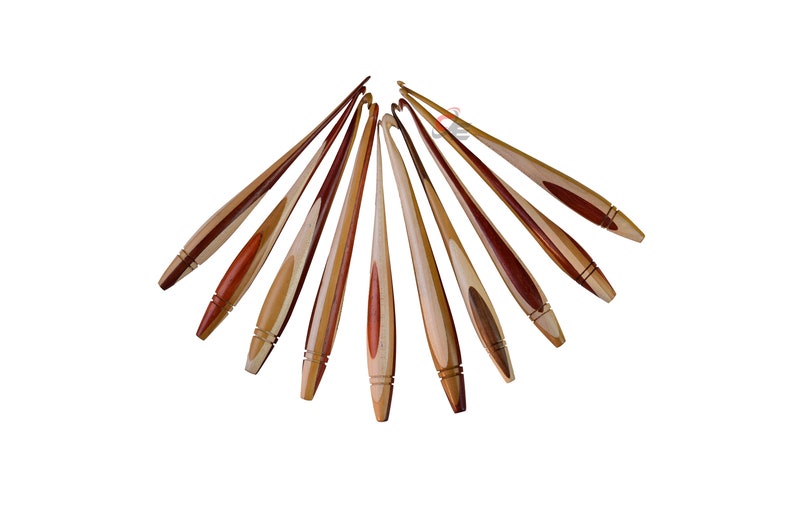 May include: A set of ten wooden crochet hooks with a natural wood and red wood finish. The hooks are arranged in a fan shape.