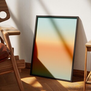 Peut inclure: Une impression abstraite encadrée avec un dégradé de couleurs allant du vert à l'orange. Le cadre est noir et l'impression est de style moderne.