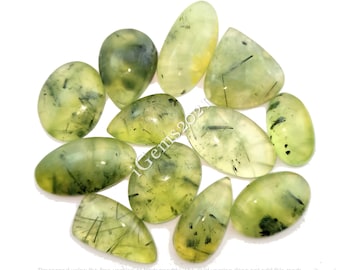 May include: A collection of 10 green aventurine cabochons with black inclusions. The cabochons are various shapes and sizes, with a smooth, polished finish.