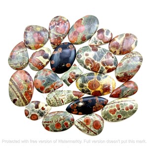 May include: A collection of 17 polished, natural, green, brown, and red jasper stones. The stones are in various shapes and sizes, with some having a speckled pattern.