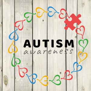 May include: An image with the words "AUTISM awareness" in black and gray text. A ring of colorful hearts surrounds the text, with a red puzzle piece at the top. The background is a light wood grain.