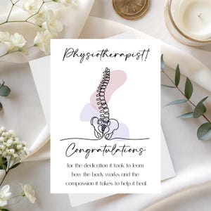 May include: A white greeting card with the word "Physiotherapist!" in elegant script. The card features a line drawing of a spine with abstract pastel shapes and the word "Congratulations". The text below reads, "for the dedication it took to learn how the body works and the compassion it takes to help it heal."