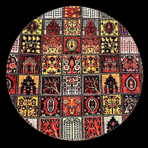 May include: A circular rug featuring a grid of square panels, each displaying intricate floral and botanical motifs in vibrant shades of red, yellow, black, and white. The repeating patterns include stylized trees, blossoms, and geometric shapes.