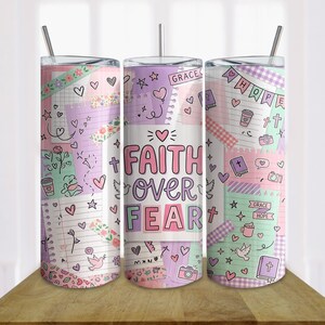 May include: Three stainless steel tumblers with lids and straws. The design features a collage of pastel-colored elements, including hearts, crosses, and the words "Faith Over Fear". The tumblers are decorated with various decorative elements.