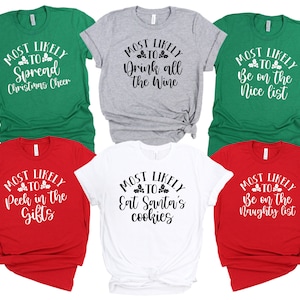 May include: Six Christmas-themed t-shirts with different sayings. The shirts are in red, white, green, and gray. The sayings on the shirts are: "Most Likely to Spread Christmas Cheer", "Most Likely to Drink All the Wine", "Most Likely to Be on the Nice List", "Most Likely to Peek in the Gifts", "Most Likely to Eat Santa's Cookies", and "Most Likely to Be on the Naughty List".