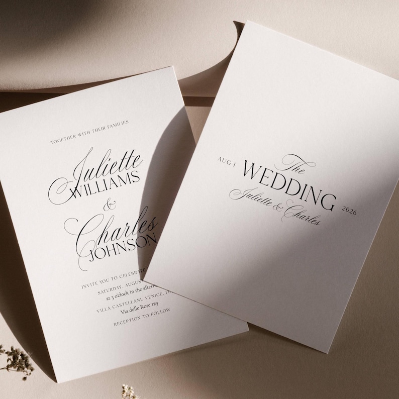 May include: Two white wedding invitation cards with elegant black script. The cards feature the names "Juliette Williams & Charles Johnson" and "The Wedding Juliette & Charles 2026". The invitations include event details.