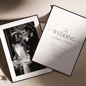 May include: Black and white wedding invitation with a photo of a couple toasting champagne. The invitation text reads "The Wedding Juliette & Charles 2026" with event details. The photo is framed with a black border.