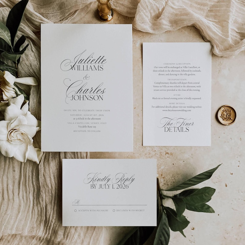 May include: Elegant wedding invitation suite with calligraphy text. The main invitation card features the names Juliette Williams & Charles Johnson. Additional cards include ceremony details, RSVP, and a wax seal. The suite is on a neutral background.