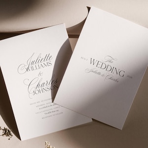 May include: Two white wedding invitations with elegant black script. One invitation reads "Juliette Williams & Charles Johnson." The other says "The Wedding Juliette & Charles 2026." Additional text includes date, time, and location.