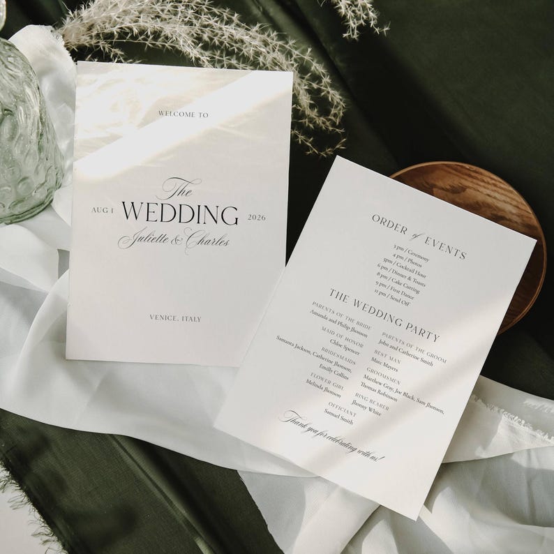 May include: Two white wedding programs with black text. One reads "Welcome to The Wedding Juliette & Charles Aug 1 2026 Venice, Italy." The other lists the order of events and wedding party details.