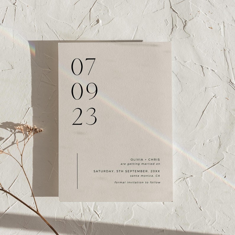 May include: A minimalist wedding save the date card with the date 07 09 23, the names Olivia and Chris, and the text "are getting married on Saturday, 5th September, 20XX, Santa Monica, CA. Formal invitation to follow."