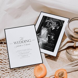 May include: Elegant wedding invitation with black border, featuring the text "The Wedding" and the names "Juliette & Charles." A black and white photo of a couple toasting is included. Apricots and a champagne glass are also visible.