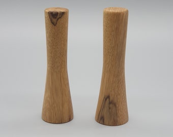 Salt and pepper shakers made from Black Limba hardwood, each mill is hand turned on a lathe and is a unique one off piece of wood art.