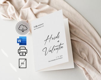 Può includere: Un biglietto bianco con testo nero che dice "Willkommen zur Trauung von Heidi + Valentin 3.10.2021 Ebersdorf am Anger".