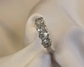 5 Oval Lab-grown Diamonds for a total of 1.5 carats on this gorgeously designed 14K/18K Gold band wedding ring.