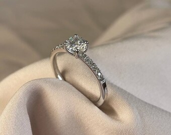 0.50 Carat Classic Round Natural Diamond Engagement Ring with 14 Side Diamonds, the extra something that makes it special.