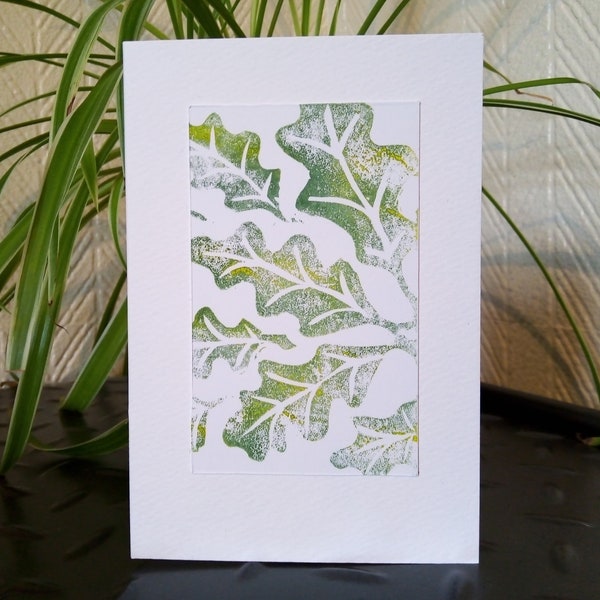 Oak leaves. Available in brown and green. A hand printed blank lino cut card from an original design