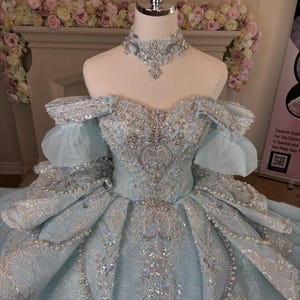 Luxury Quinceanera Princess Ball Gown evening gown, available in Blue or Pink, with hand-beaded bodice and corset back