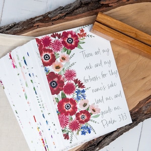 May include: A stack of cards with a floral design and the text "Thou art my rock and my fortress, for thy name's sake lead me, and guide me. Psalm 31:3".